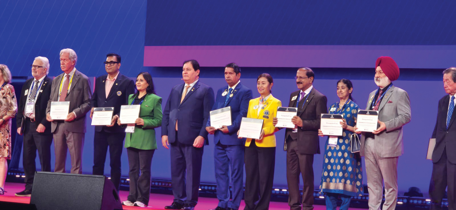 Million Dollar Donor V.P. Nandakumar stands alongside other distinguished donors honoured on stage at the Lions International Convention held in Hong Kong.