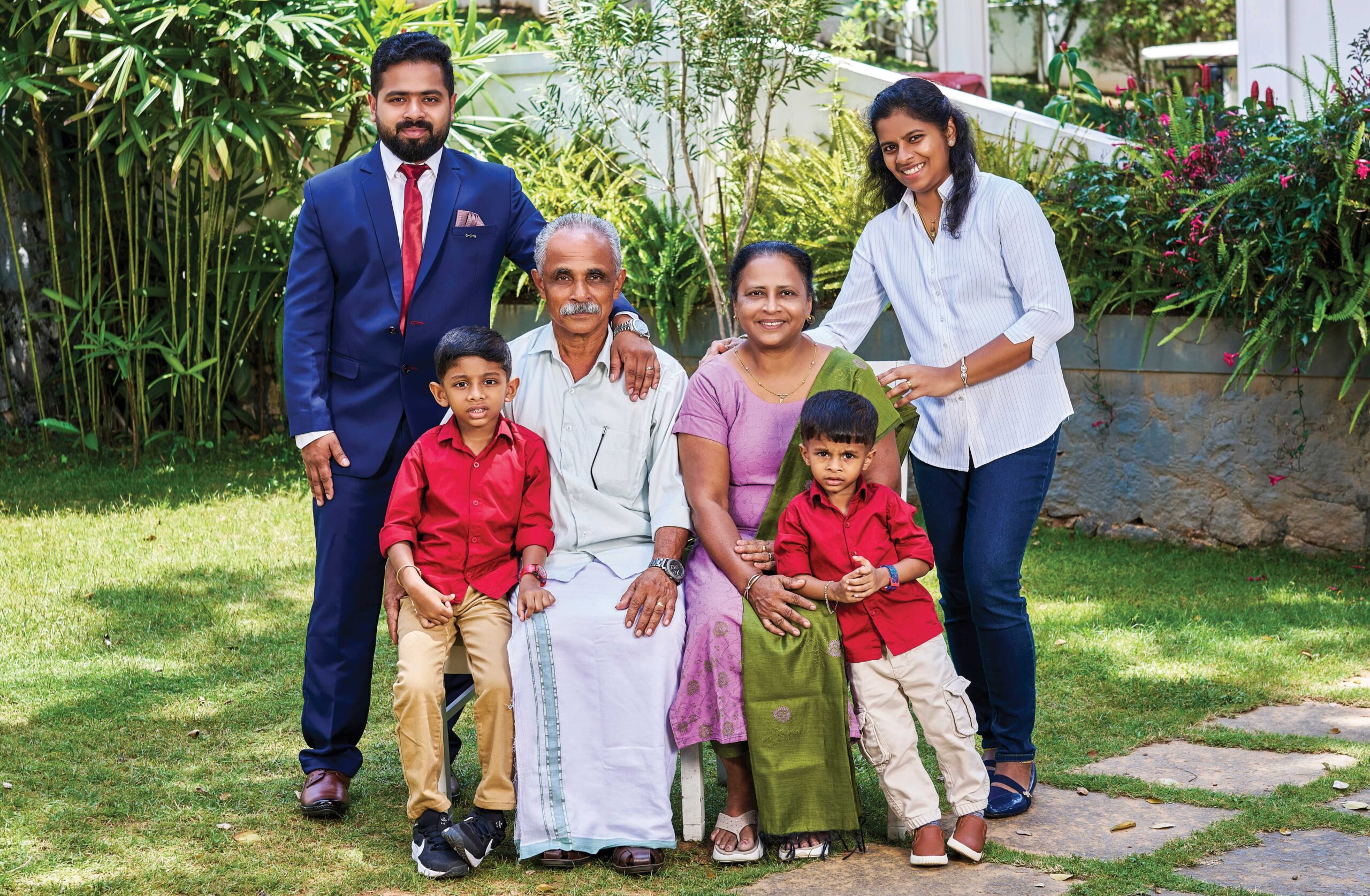 Jijin Jimmichan with his parents Jimmichan and Marykutty, wife Dona, sons Johan and Jion